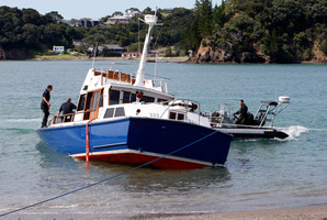 The New Zealand Navy's VIP Barge aground on the beach at Tutukaka. Photo / John Stone
