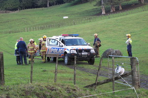 Police and firefighters at the scene of a fatal quad bike accident on a rugged Awarua farm in 2010. File photo / APN