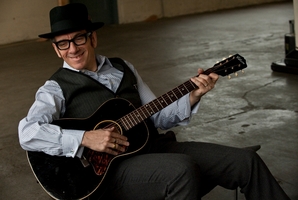 Elvis Costello is bringing his band The Imposters. Photo / Supplied