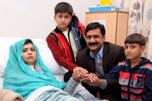 Pakistani schoolgirl Malala Yousafzai, who was shot in the head by Taliban gunmen for campaigning for the right to an education, with her brothers and father. Photo / AFP