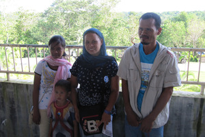 Bing Mangisig (centre) and her family fled when their village was seized by a breakaway rebel group. Photo / Nicholas Jones