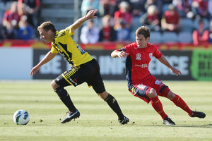 Phoenix defender Ben Sigmund eludes Adelaide's Jeronimo Neumann. Photo / Getty Images