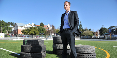 Pacific Rubber co-founder Andrew Christie on St Peter's College's synthetic sports field. Photo / Supplied