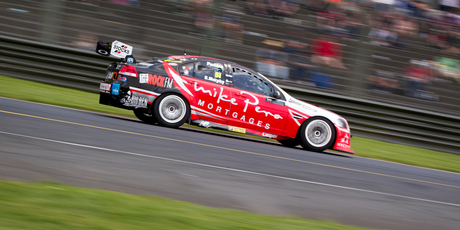 Greg Murphy and Jack Perkins show winning style as they speed past the grandstands at Pukekohe yesterday. Photo / Sarah Ivey