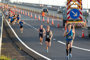 Runners cross the Auckland Harbour Bridge during yesterday's marathon. Photo / Richard Robinson