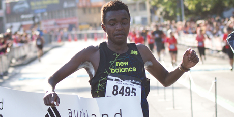 Sleepyhead Kenyan Edwin Kaitany crosses the finish to win the Auckland half marathon yesterday. Photo / Richard Robinson.