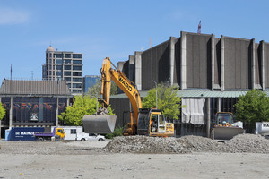 Excavation machinery at work on the empty Convention Centre site, with the earthquake damaged Christchurch Town Hall in the background. Photo / Christchurch Star