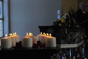 Candles are lit at Shaun Hogarth's funeral. Photo / George Novak