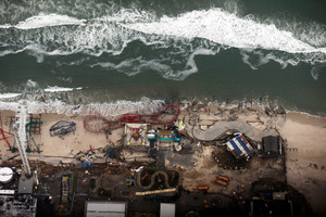 Debris from an amusement park destroyed during Superstorm Sandy lines the beach in Seaside Heights, N.J. Photo / AP