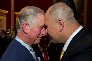Britain's Prince Charles is greeted by Bruce Simpson from the Ngati Ranana London Maori Club, at St. James's Palace ahead of his trip. Photo / AP