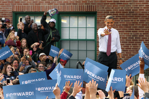 President Barack Obama waves to supporters as he arrives for a campaign event at Elm Street Middle School in New Hampshire. Photo / AP