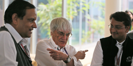 Bernie Ecclestone, centre, gets a birthday gift before the Indian Grand Prix. Photo / AP