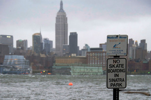 The Hudson River swells and rises over the banks of the Hoboken, N.J. waterfront. Photo / AP