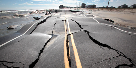 Road to nowhere. North Carolina 12 is buckled from pounding surf leading into Mirlo Beach in Rodanthe, N.C. Photo / AP