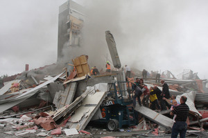 Rescuers search for survivors on top of rubble at the CTV site. Photo / Geoff Sloan