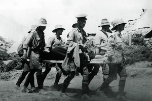 An all too familiar sight - stretcher-bearers coming in with a casualty at Gallipoli. Photo / New Zealand Herald