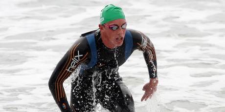 Kane Radford emerges from the water to finish second in the State Sand to Surf Swim at Mount Maunganui. Photo / Supplied