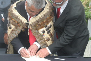 Haami Piripi, Te Rarawa leader, signs the Te Rarawa deed of settlement. Photo / Northern Advocate