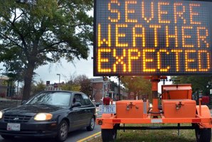 A road sign warns drivers of weather conditions in downtown Washington ahead of Hurricane Sandy's landfall. Photo / AFP