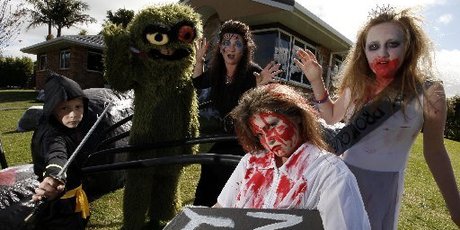 Getting ready for a good scare outside their Maunu home are Trinity Alp, age 9, in front, and behind her from left are ninja Pheonix Alp, age 7; Brayden Le Noel, age 12, as Oscar the Grouch; Leanne Martinovich and Mikayla Le Noel, age 10. Photo / Supplied