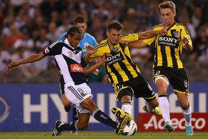 Jonathan Bru of the Victory contests with Vince Lia and Tyler Boyd for the ball. Photo / Getty Images