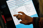 A voter prepares casts her electronic ballot in Madison. Photo / AP A voter prepares casts her electronic ballot in Madison. Photo / AP