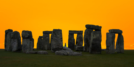 The henge at sunrise would hardly be complete without a Druid. Photo / Getty Images
