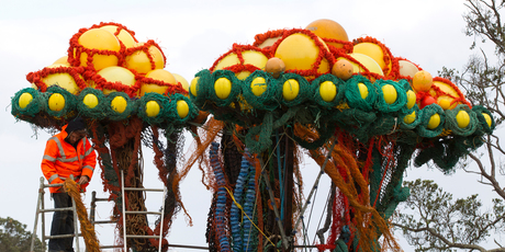 Sculptor Sacha Nunn puts the final touches to his "Fukushima in the ocean of complacency." Photo / Brett Phibbs