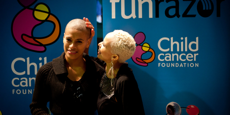 Megan Alatini admires Vilomena Ole's shaved head yesterday. Pictures / Dean Purcell Megan Alatini admires Vilomena Ole's shaved head yesterday. Pictures / Dean Purcell