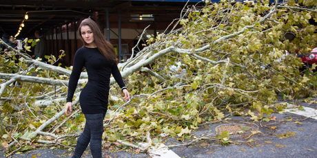 Former Playboy model Nana Gouvea poses amid debris from the storm. Photo / Supplied