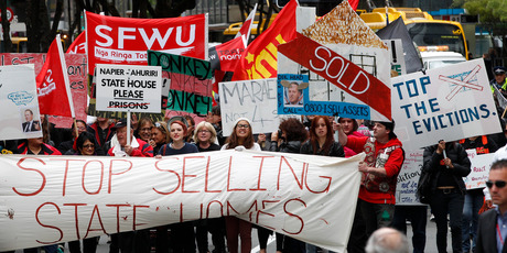 About 100 people marched yesterday in protest at the closure of Housing NZ properties. Photo / Mark Mitchell