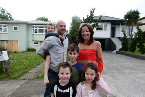 Phil Ivey and Michelle Dowd - pictured with Ryder, Ethan, Emerson Ivey and Kate Anderson - have bought "a bit of a dog" next door. Photo / Doug Sherring