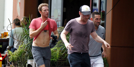 Coldplay frontman Chris Martin and guitarist Jonny Buckland work up a sweat. Photo / Michael Craig