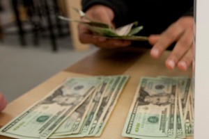 Carrying a lot of cash is risky, especially in poorer countries. Photo / AP