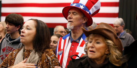 Supporters of Mitt Romney pray before the arrival of their candidate at a campaign rally in Cleveland. Photo / AP