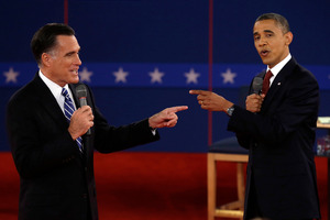Republican presidential candidate Mitt Romney (left) and President Barack Obama spar during the second presidential debate. Photo / AP