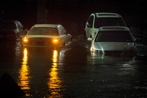 Vehicles are submerged during Superstorm Sandy in New York. Photo / AP