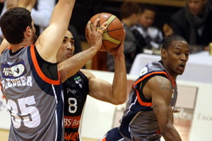 Hawks captain Paora Winitana looks for space between Auckland Pirates centre Alex Pledger (left) and Us import Ron Dorsey. Photo / APN