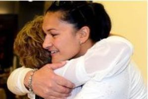 Shot put champion Valerie Adams and New Zealand team manager Raylene Bates hug in Dunedin yesterday. Photo / Gerard O'Brien