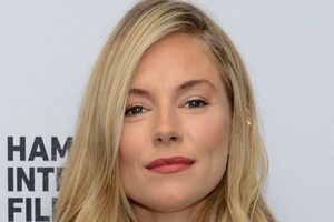 Sienna Miller posed naked when she was pregnant. Photo / AFP