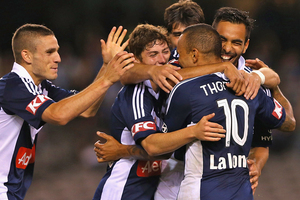 The Victory celebrate one of their three goals against the Phoenix. Photo / Getty Images