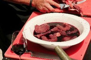 Venison cuts were left to marinate in Trinity Hill red wine during the Homage to the BBQ at Trinity Hill on Saturday. Photo / Hawke's Bay Today