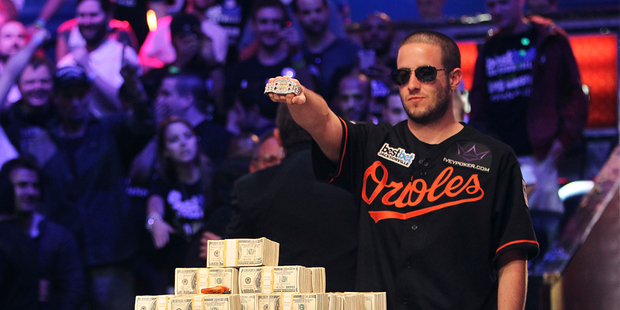 Greg Merson holds up his new bracelet after winning the World Series of Poker No-Limit Hold'em Main Event. Photo / AP