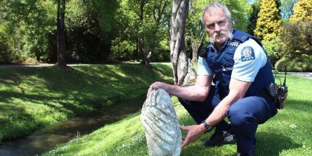 Oamaru police Community Constable Bruce Dow is seeking information from the public to identify this piece of Oamaru stone from a statue. Photo / Rebecca Ryan