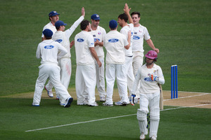 Auckland's Dean Bartlett celebrates the wicket of James Marshall. ND were torn apart twice by the Aces' bowlers. Photo / Photosport