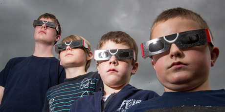 From left, Connor Hackney, 13, Jackson Clayton, 11, Liam Hackney, 8, and Caleb McCormack-King, 7, show off their protective eclipse glasses. Photo / Kellie Blizard