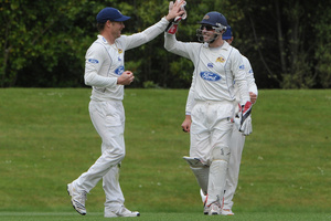 Aaron Redmond and Derek de Boorder (right) celebrate a wicket. Photo / ODT