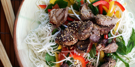 Pork is given an Asian flavour in this honey and sesame salad. Photo / Doug Sherring