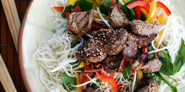 Pork is given an Asian flavour in this honey and sesame salad. Photo / Doug Sherring