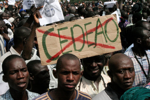 Malians opposing a foreign military intervention to retake Mali's Islamist-held north carry signs protesting. Photo / AP